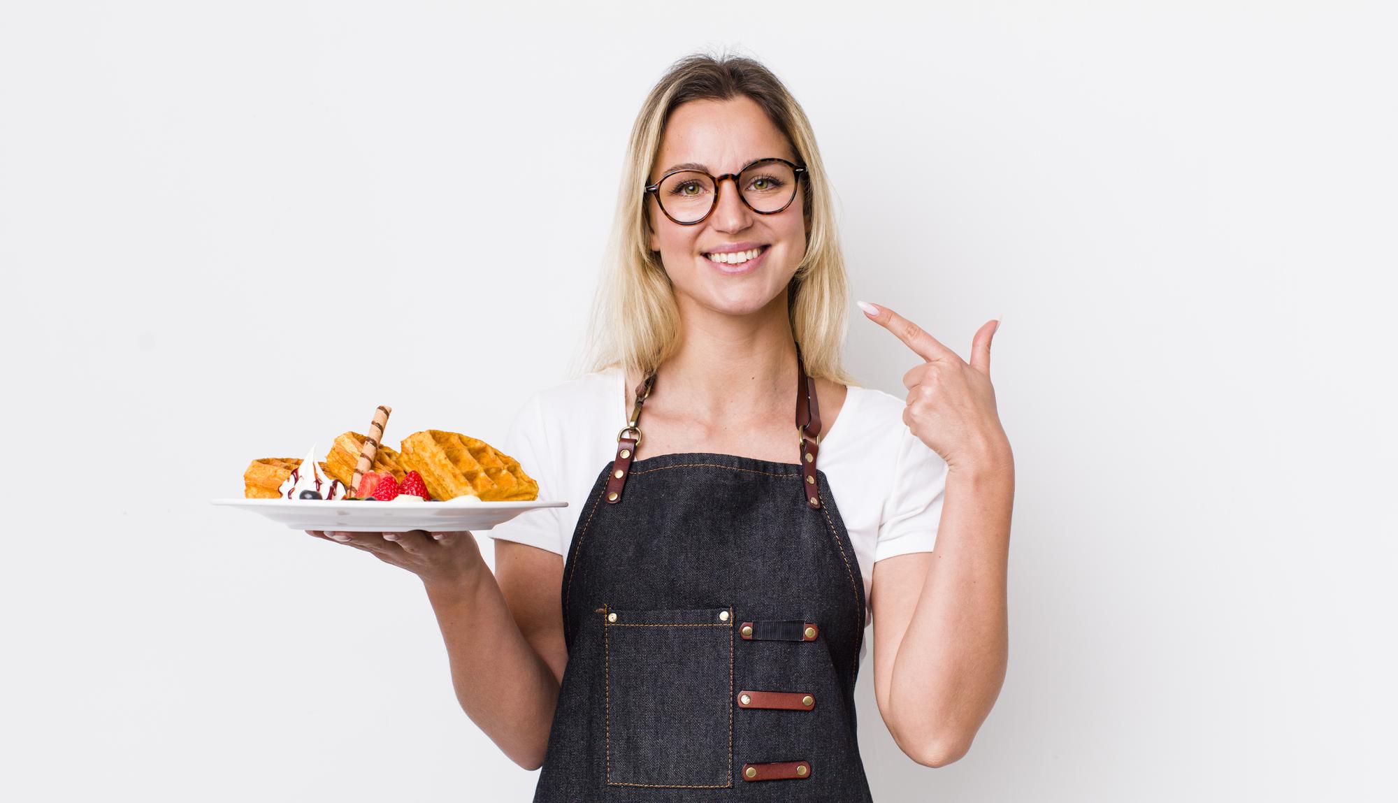Student presenting plated main course